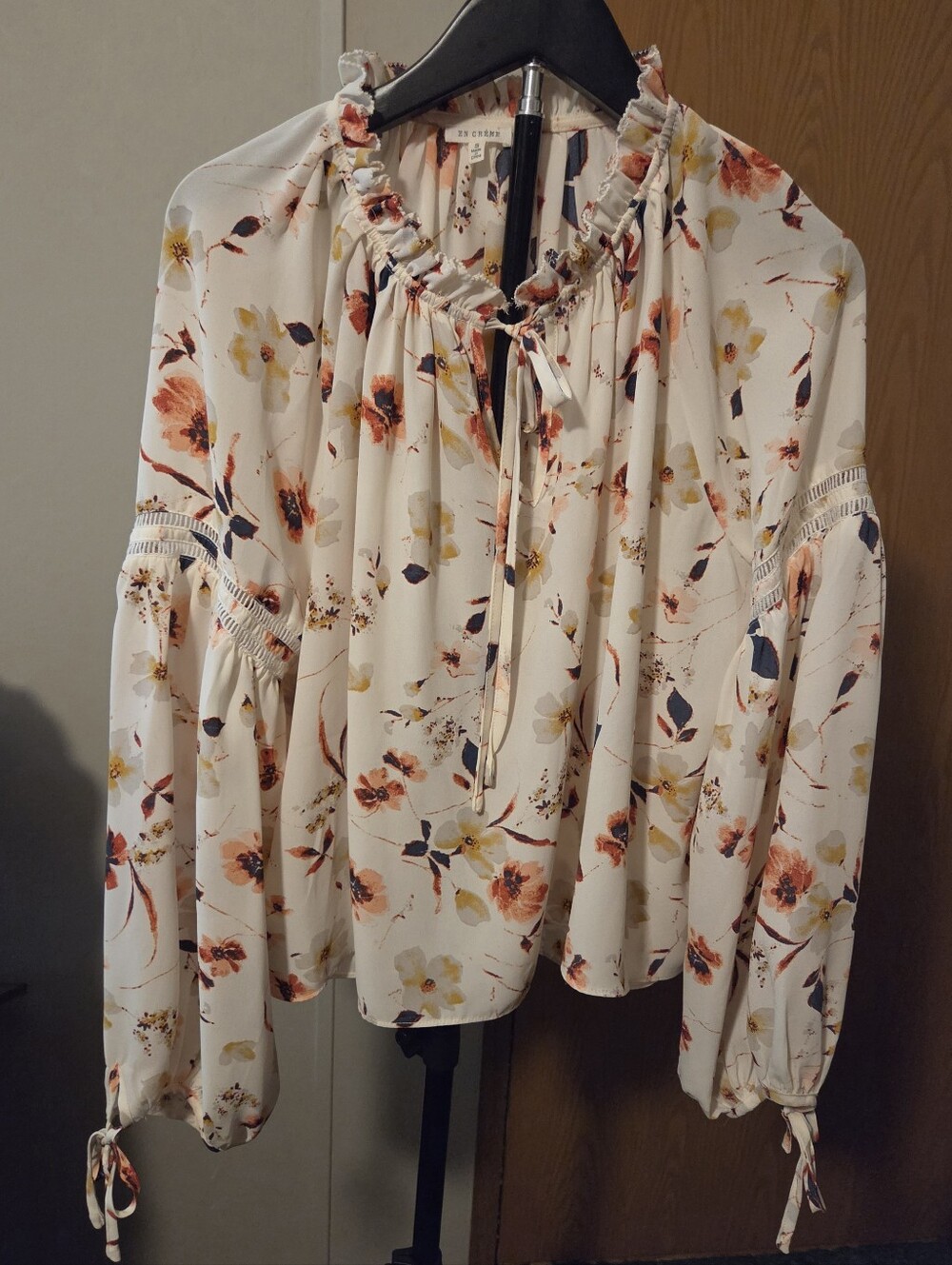 En Creme Cream Floral Ruffle Tie-Neck Blouse with Rust & Navy Accents